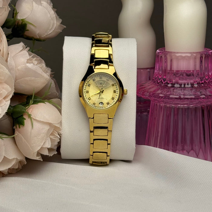 Sophisticated gold-tone dial with crystal hour markers.